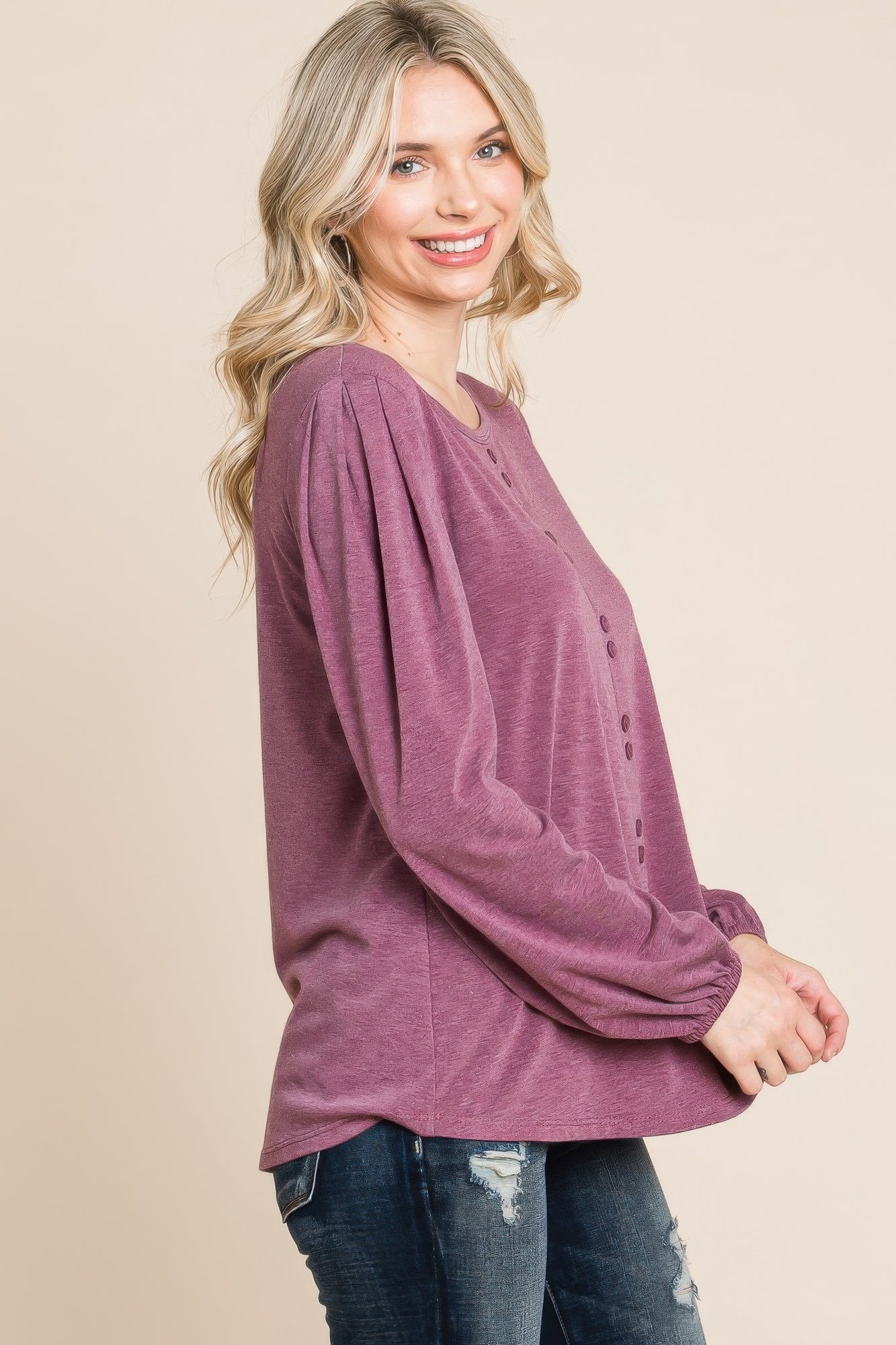 Burgundy long sleeve Henley top, side view with button placket detail