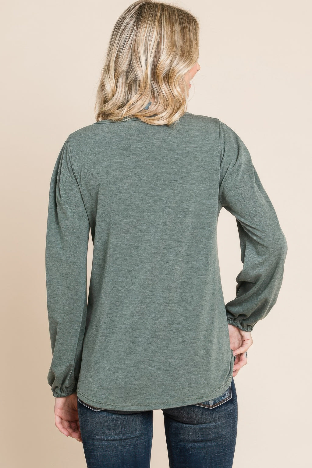 Solid long-sleeve top back view in olive green knit with gathered cuffs