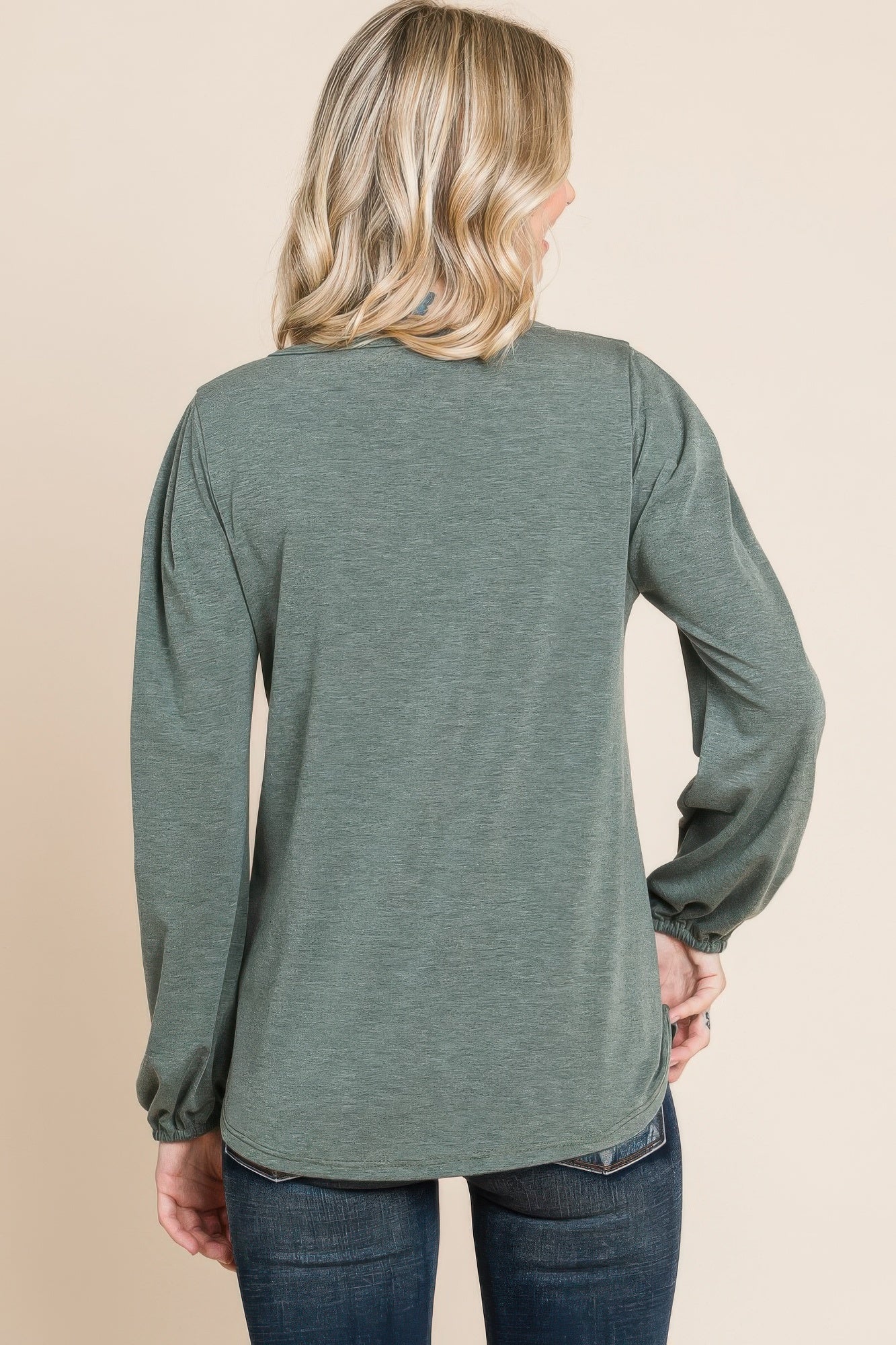 Solid long-sleeve top back view in olive green knit with gathered cuffs