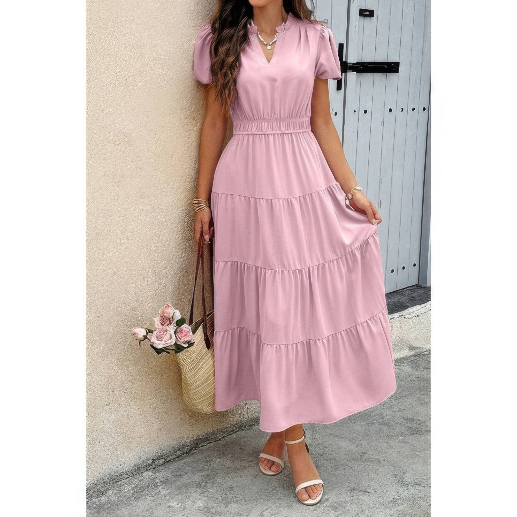 Pink tiered V-neck dress with elastic waist and short puff sleeves