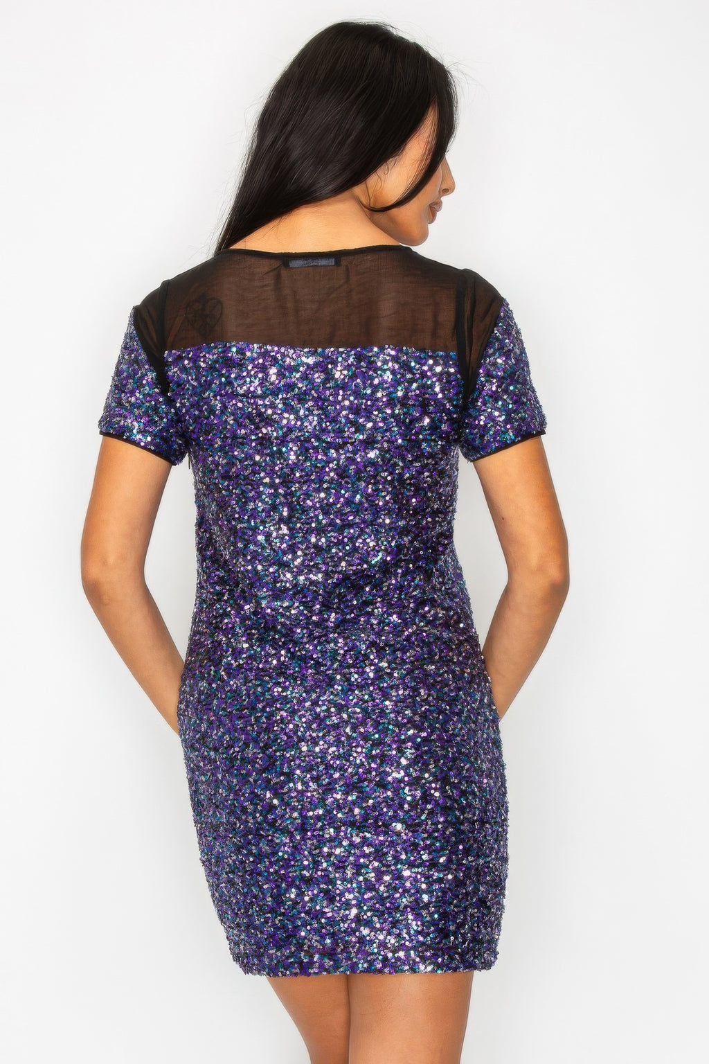 Back view of sequin mini dress with black mesh upper yoke, purple multicolor sparkle