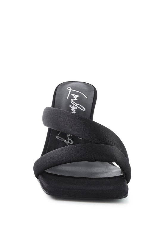 Black cross-strap slide heels with open toe and padded-looking footbed