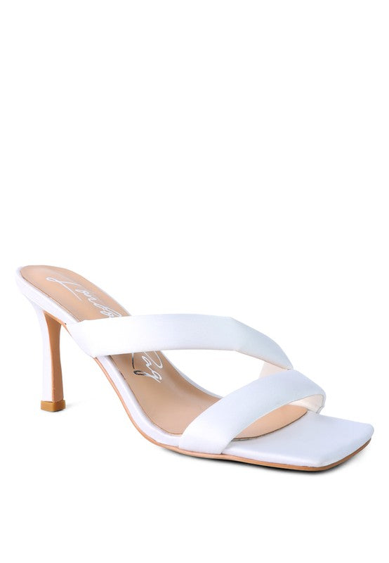 Off-white cross-strap heels with open toe, smooth straps, and high heel