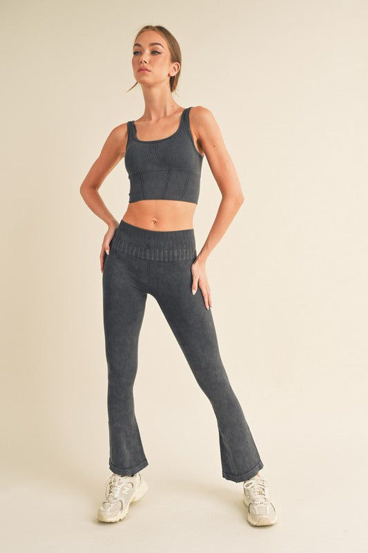 Ribbed sports bra with wide straps and seamed cups, dark grey color.