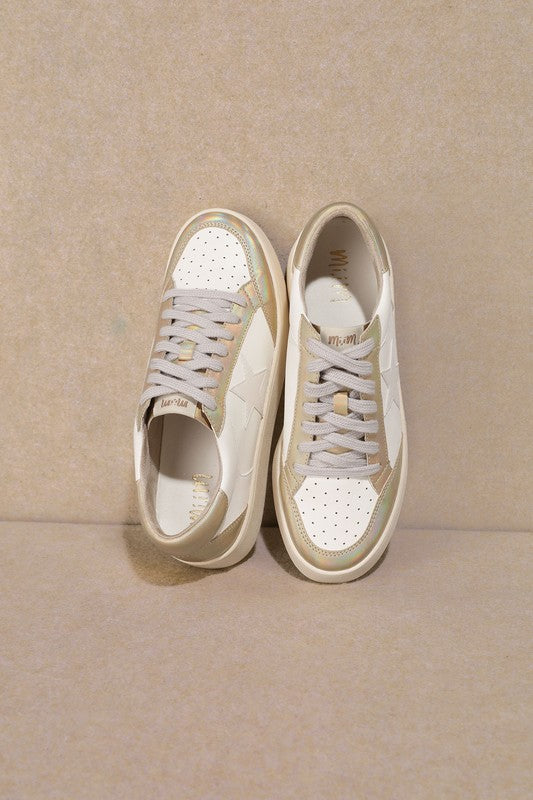 White low-top sneakers with lace-up closure, star logo on side and perforated toe