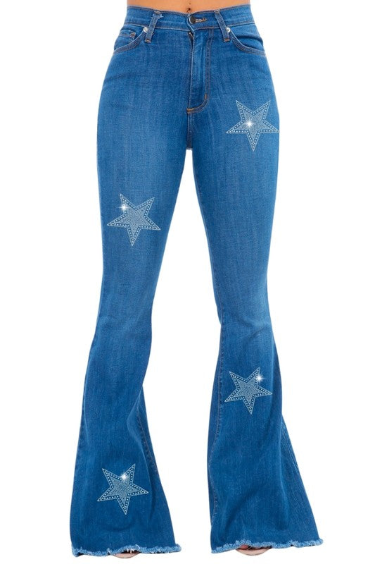 Blue bell-bottom jeans with rhinestone star patches on legs and front pockets