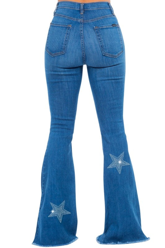 Back view: blue rhinestone star flares on bell-bottom denim, five-pocket style