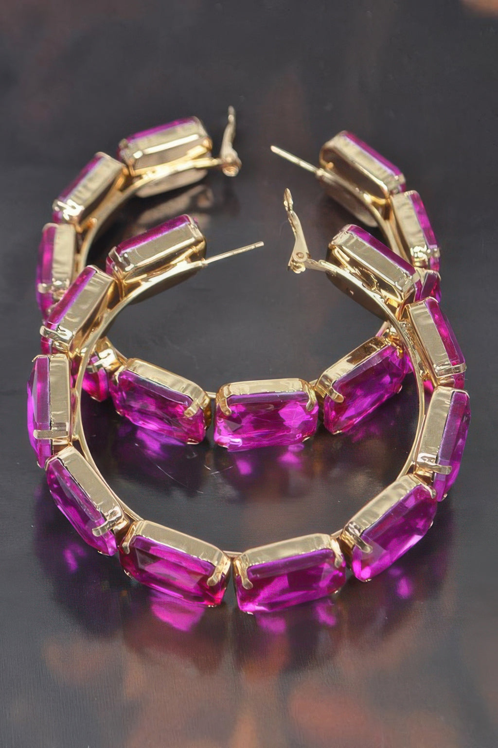 Fuchsia stone hoop earrings with gold-tone bezels and stud back