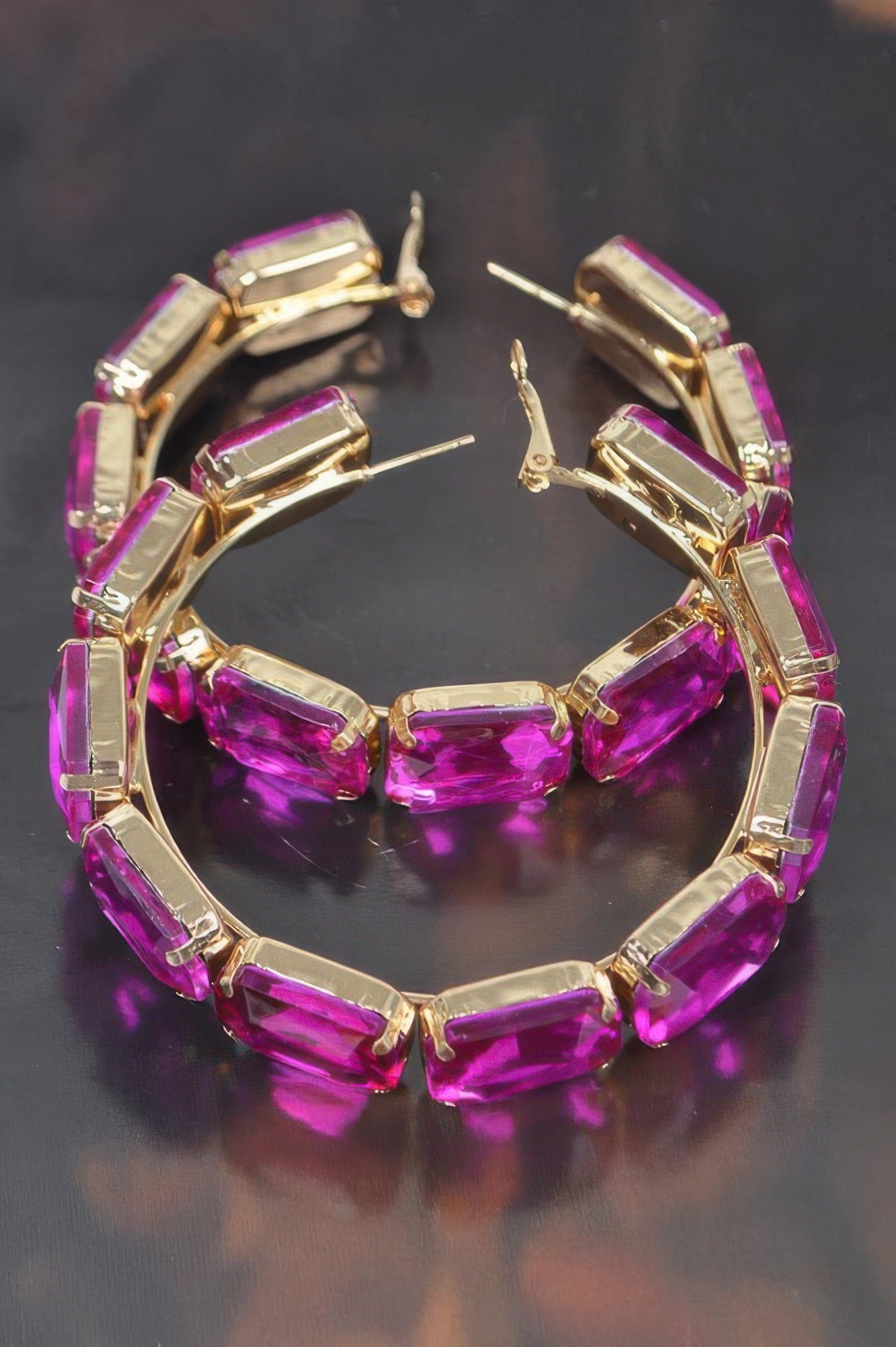 Fuchsia stone hoop earrings with gold-tone bezels and stud back