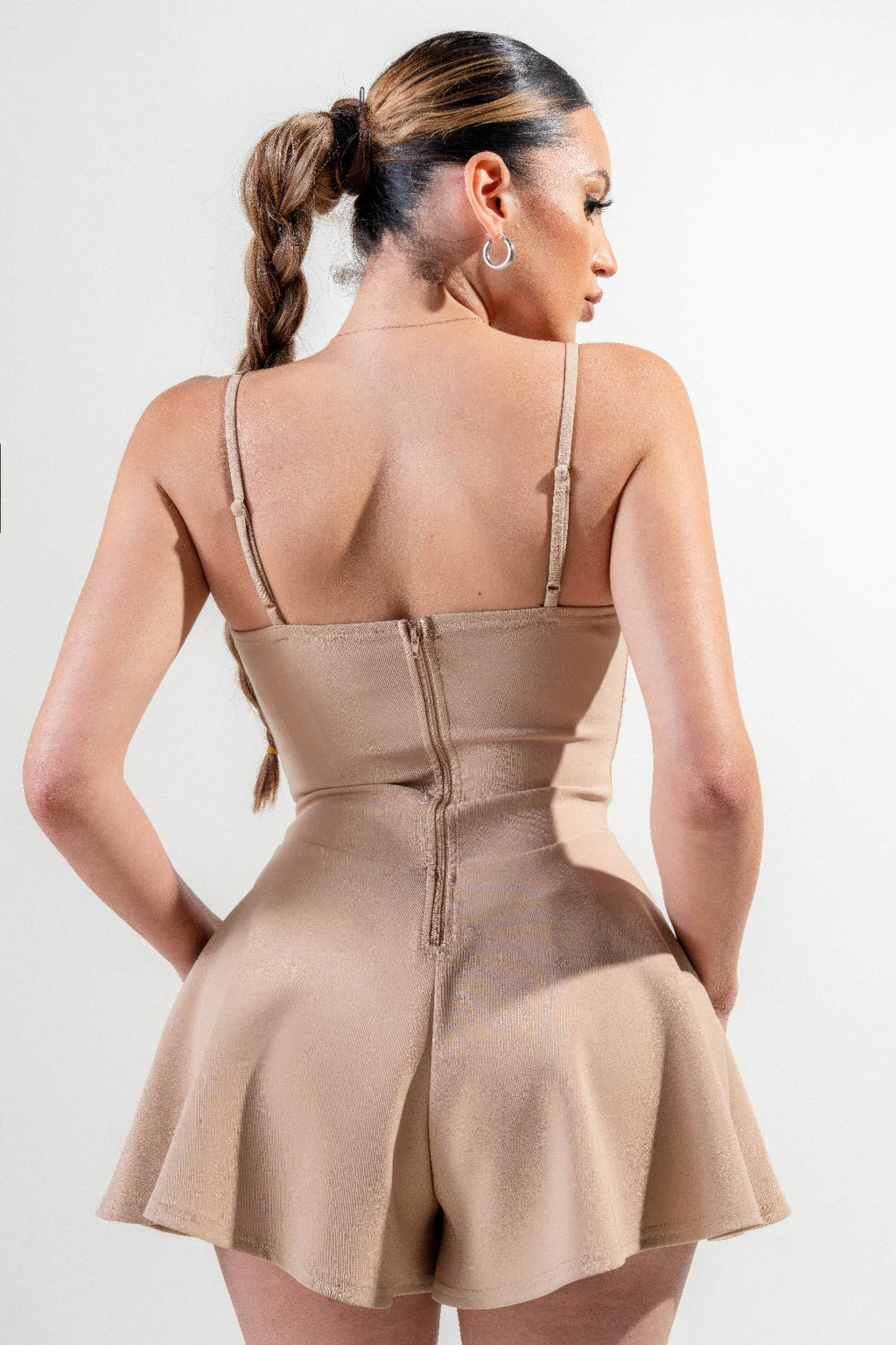 Stretch Woven Jumpsuit in cappuccino, back view with center zipper and open-back design