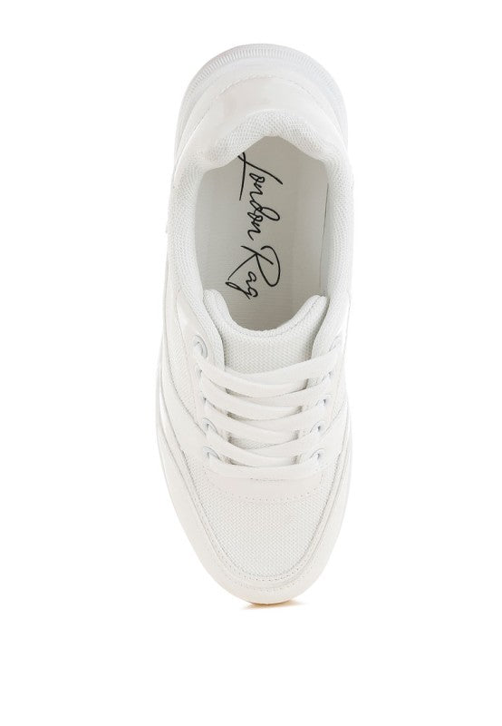 White sneaker interior view with mesh lining and lace-up closure