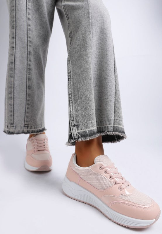 Pink chunky lace-up sneakers with mesh upper and white midsole.