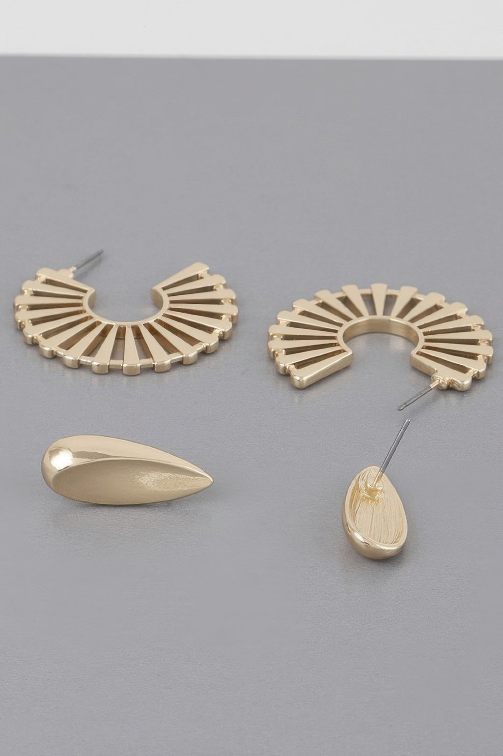 Sunray flat hoop earrings in gold-tone; fan-shaped hoops and teardrop drop pieces.