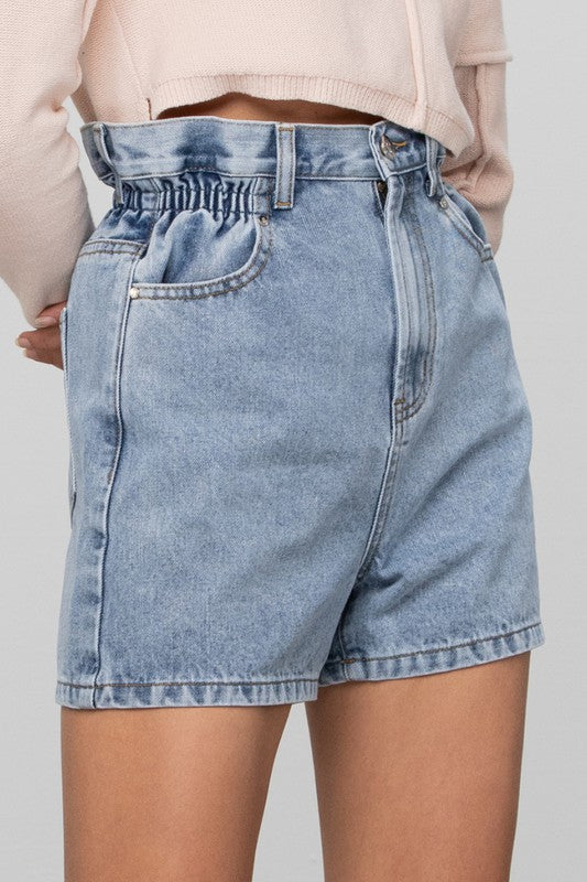 Light-wash high-rise denim shorts with elastic waistband and front scoop pockets