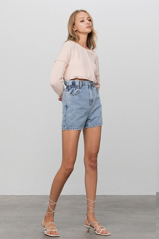 Light-wash high-rise denim shorts with elastic waistband, relaxed fit, cuffed hem