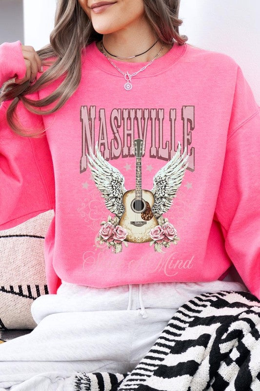 Light pink sweatshirt with Nashville guitar wings graphic and “State of Mind” print