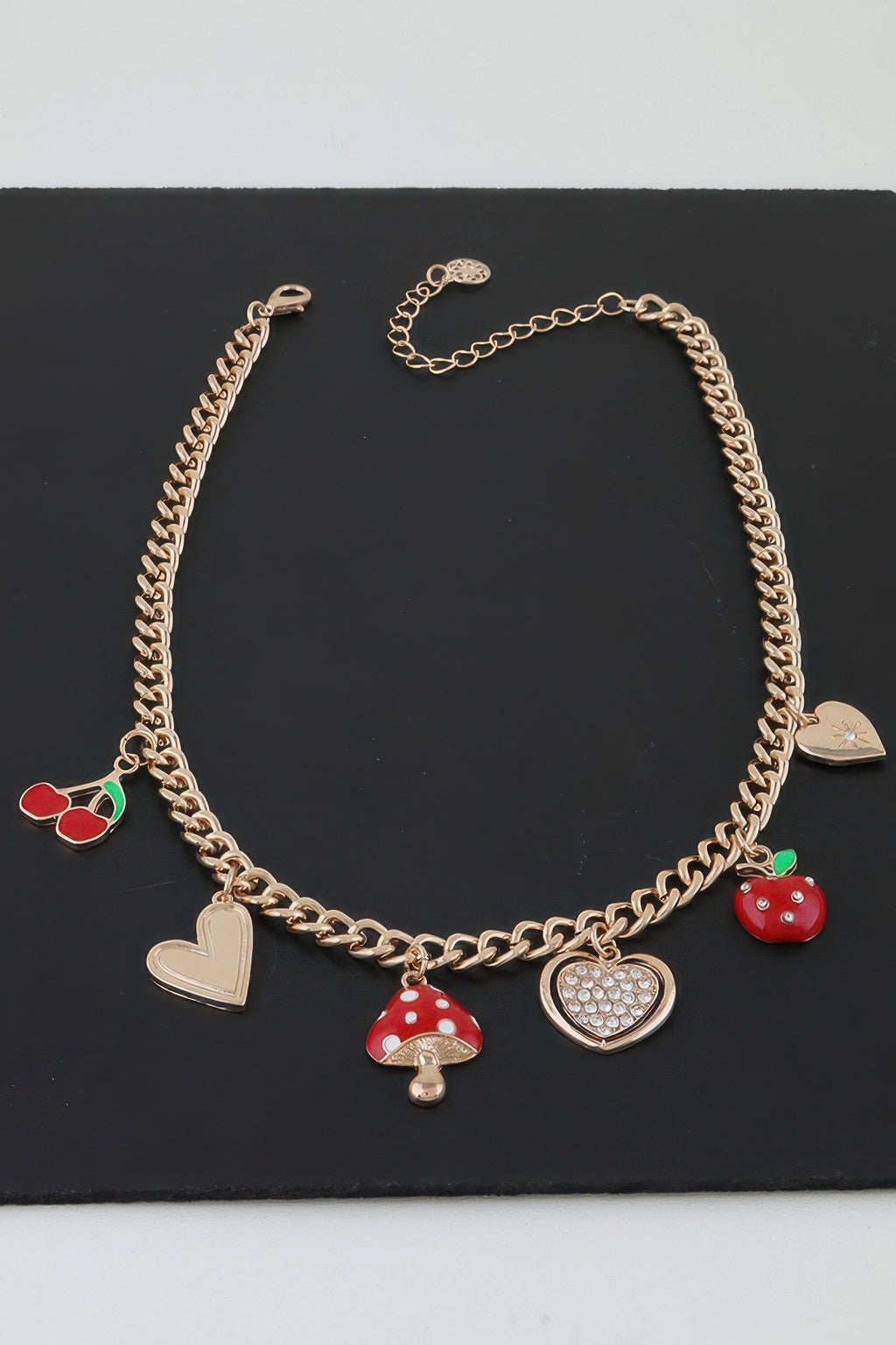 Gold charm chain necklace, red mushroom and apple charms with heart pendants