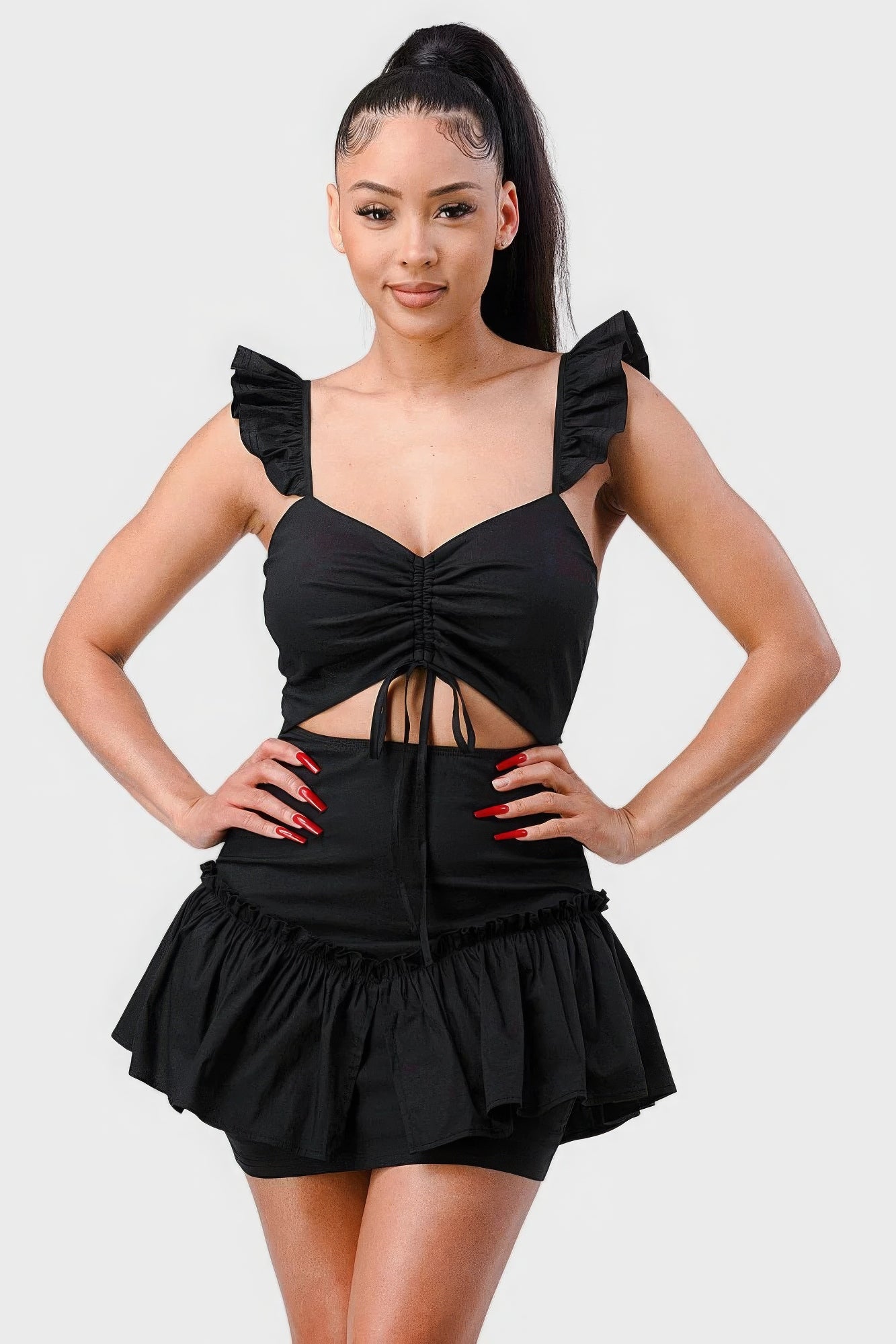Black mini dress with sweetheart neckline, ruched bodice, drawstring bow cutout, flutter sleeves