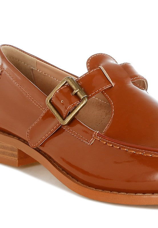 Cognac Mary Jane loafer buckle strap and glossy patent finish (close-up)