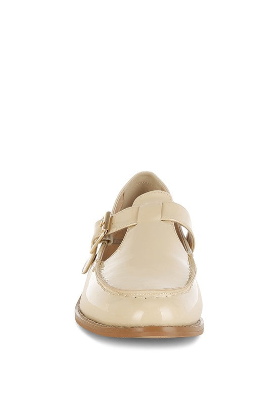 Beige patent Mary Jane loafers with buckled strap, closed toe and low heel