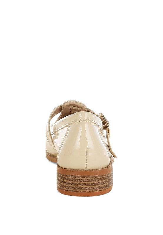 Beige patent Mary Jane loafers, rear view with block heel and ankle strap