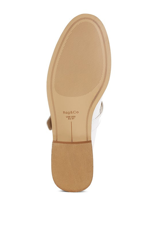 Beige patent Mary Jane loafers outsole and heel, textured sole pattern