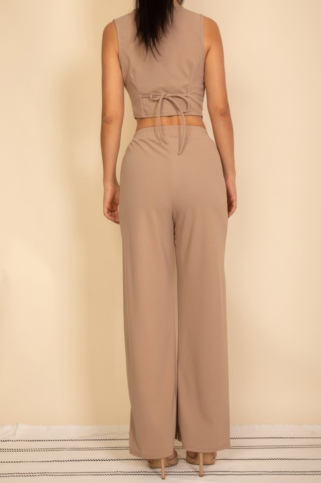 Taupe button-up vest with adjustable back tie and matching wide-leg pants