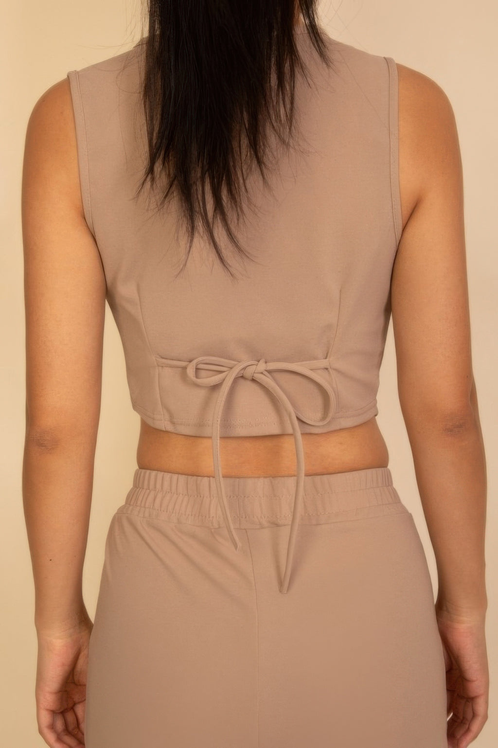 Taupe sleeveless vest with back-tie drawstring and wide-leg pants set