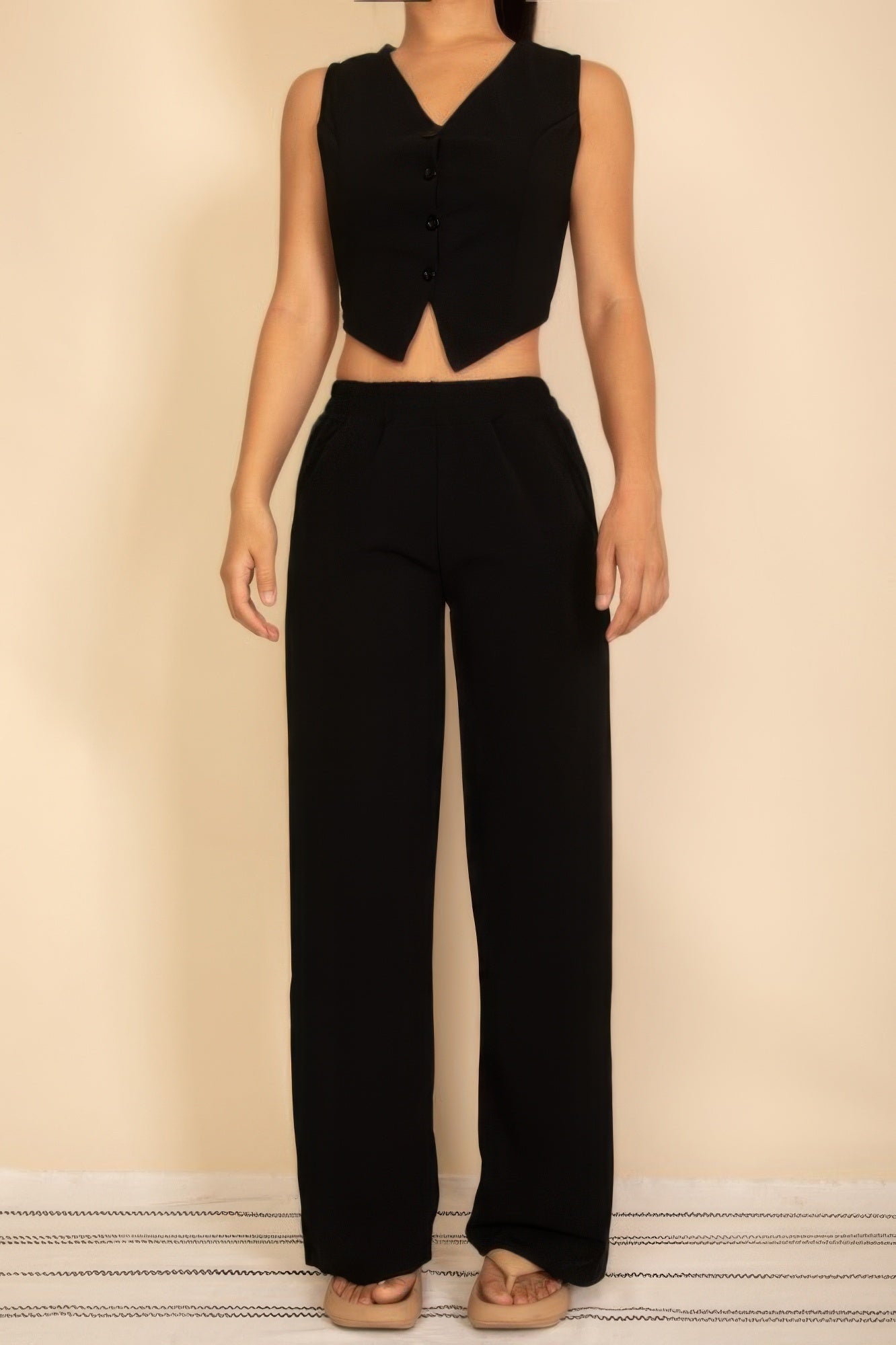 Black tailored button vest with adjustable back tie and wide-leg pants set