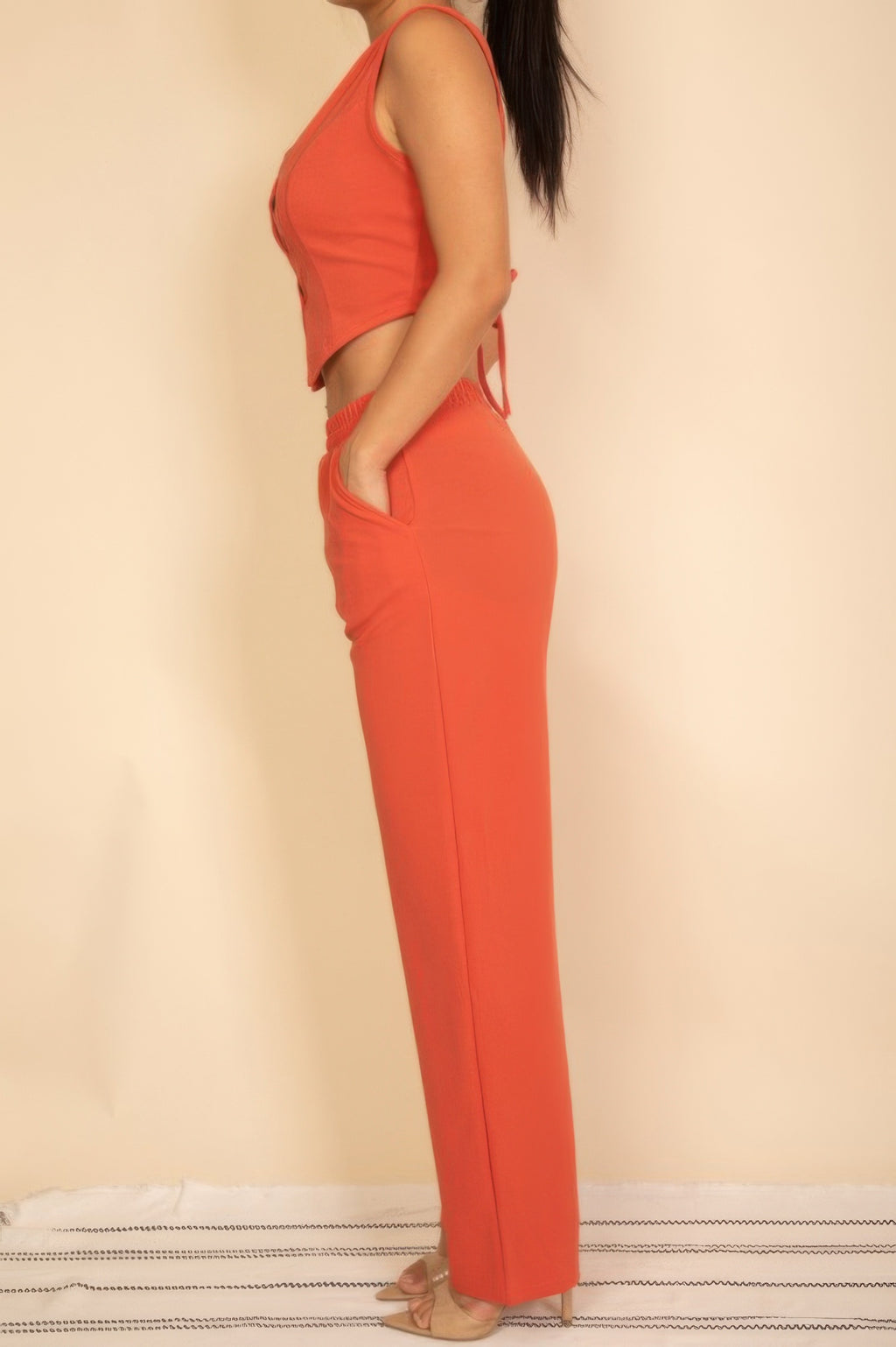 Rust-red vest and wide-leg pants set, sleeveless with button front