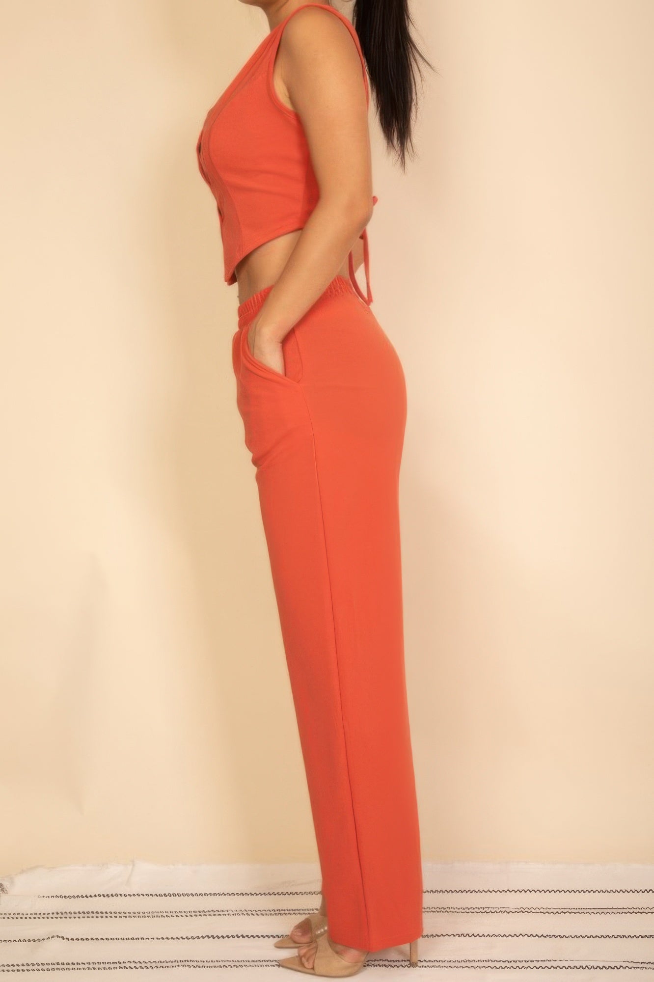 Rust-red vest and wide-leg pants set, sleeveless with button front
