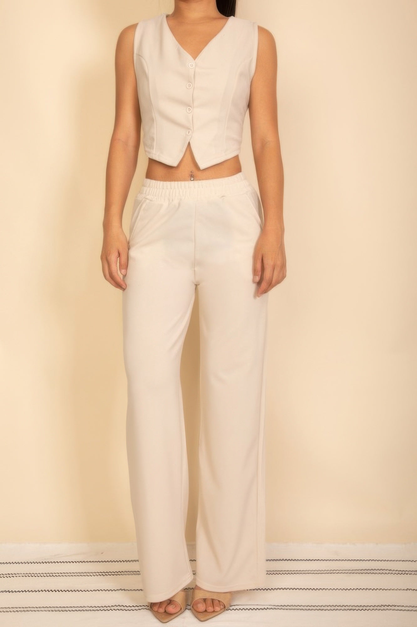Tailored button vest and wide-leg pants set in off-white, front button placket