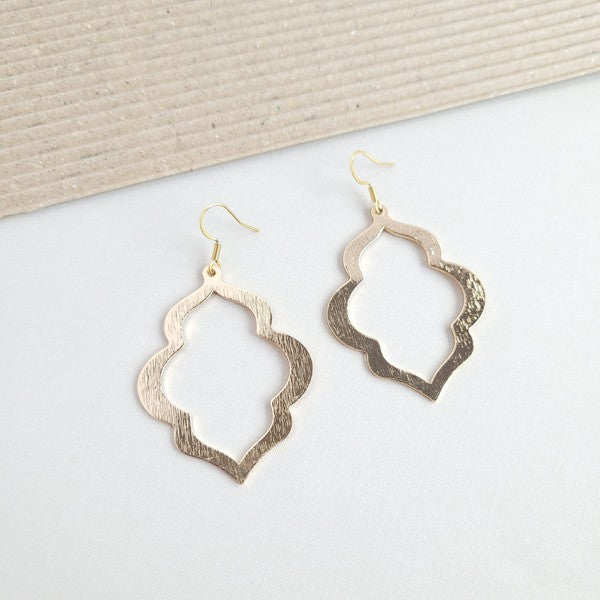 Gold drop earrings with quatrefoil silhouette and openwork center cutout
