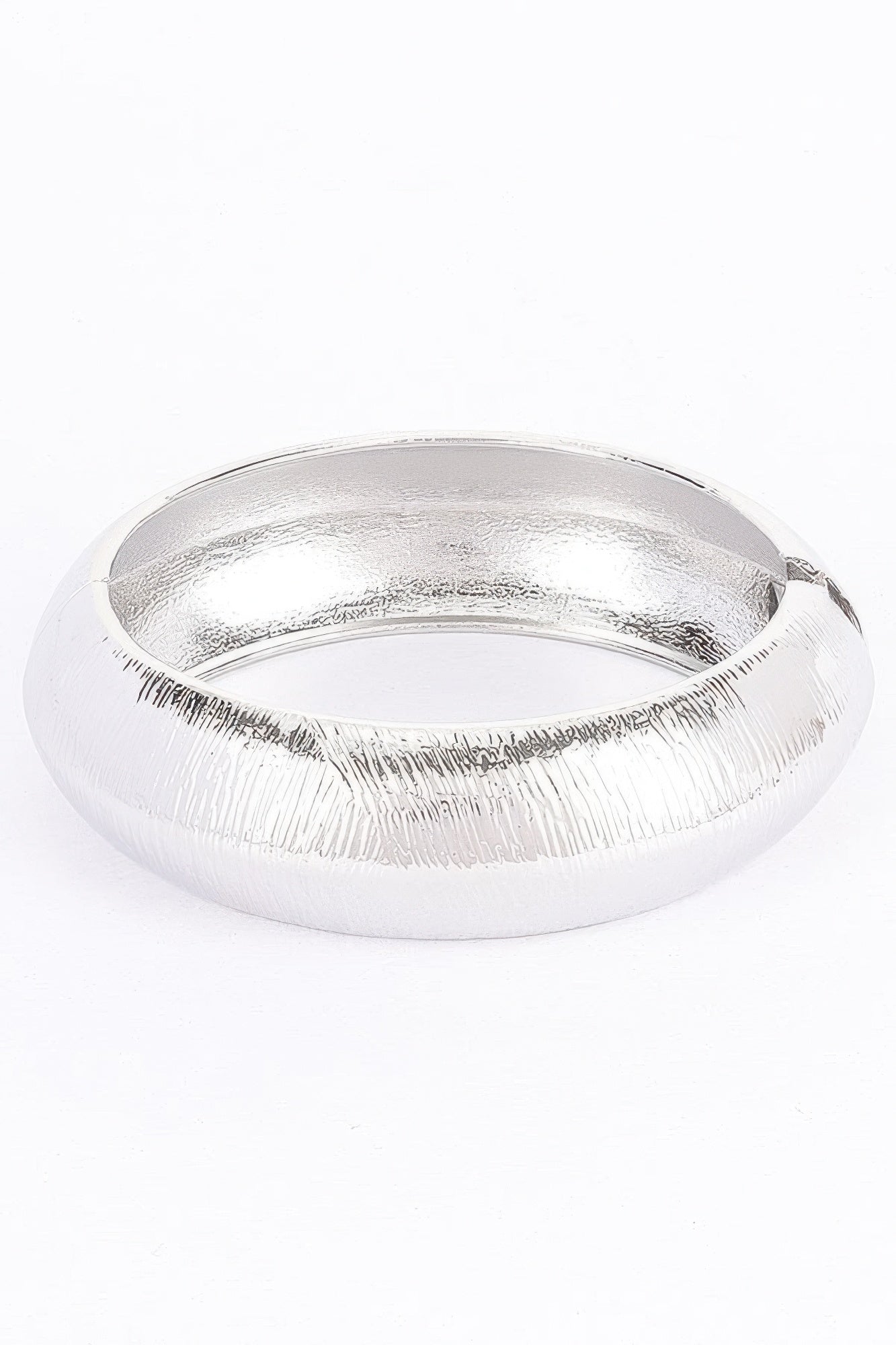 Silver textured metal bangle bracelet, smooth inner opening and ribbed outer finish