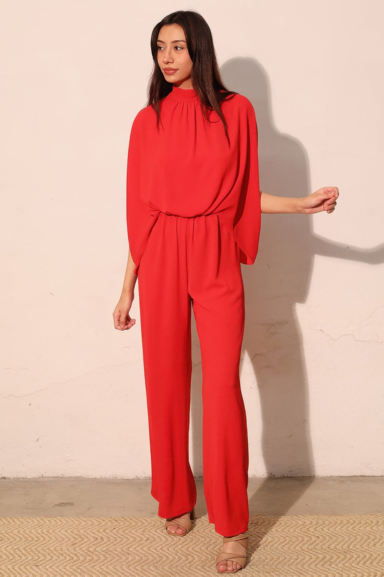 True red mock neck caftan jumpsuit with elastic waist and wide-leg pants