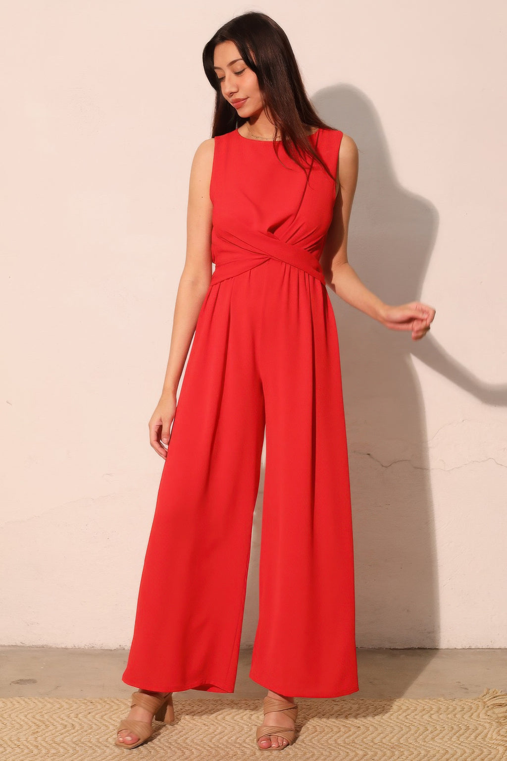 True red twist-front jumpsuit with gathered waist and wide legs