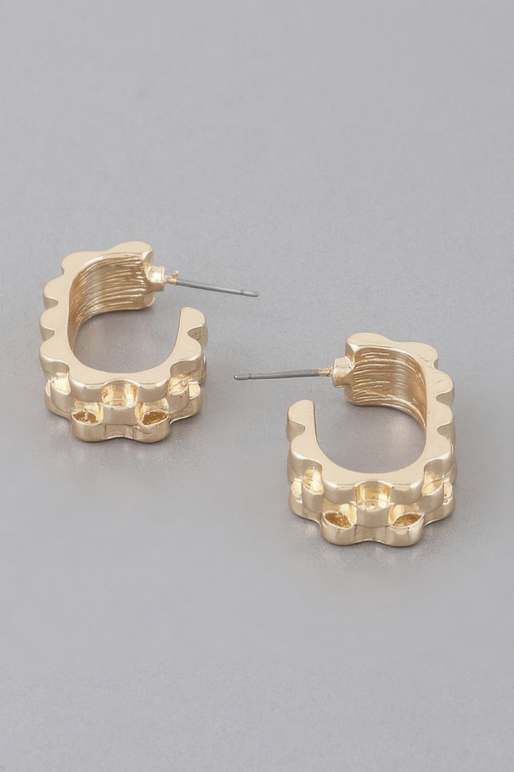 Textured ware brass cuff earrings, gold-tone, side view with scalloped cuff and posts