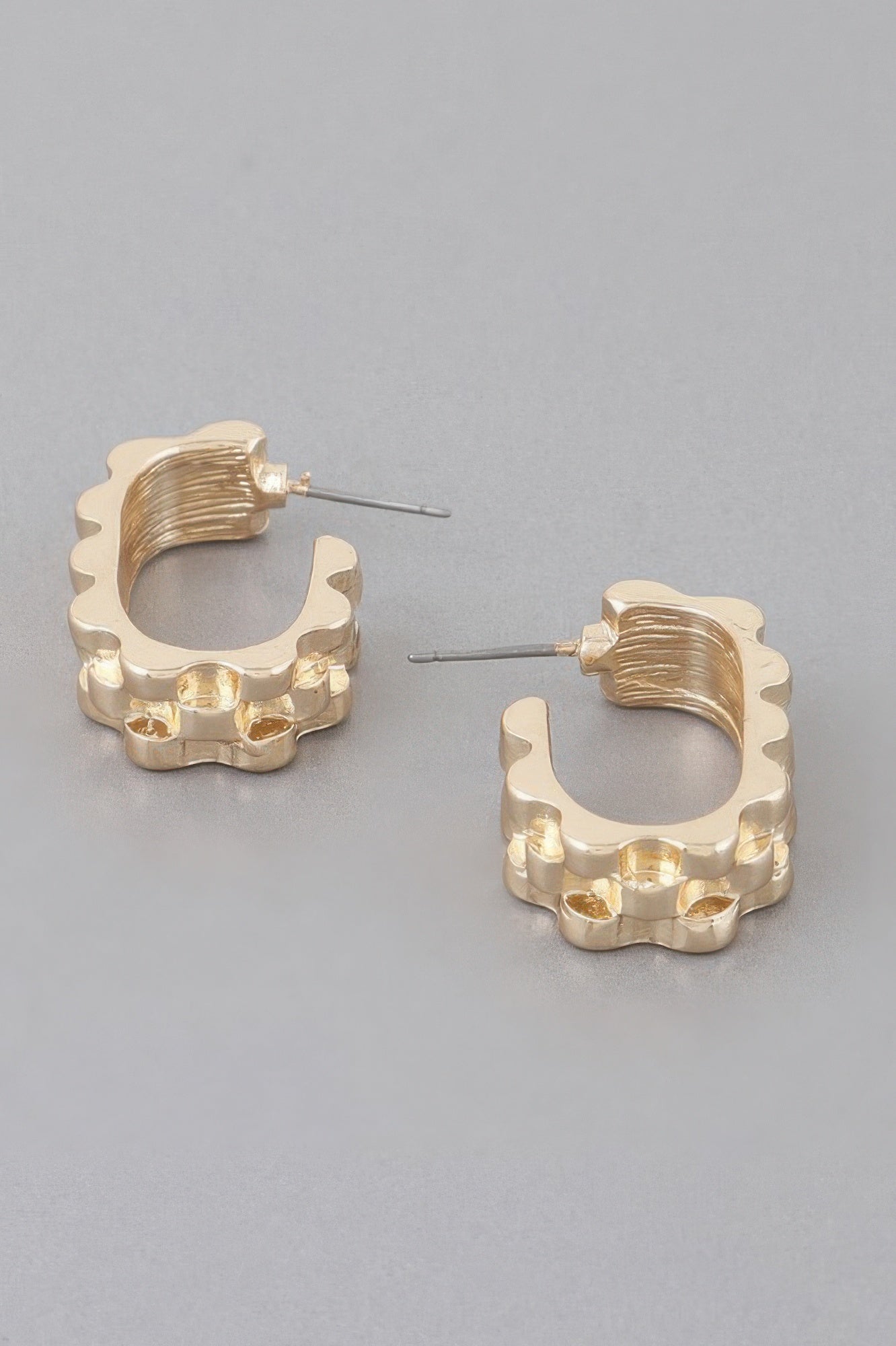 Textured ware brass cuff earrings, gold-tone, side view with scalloped cuff and posts