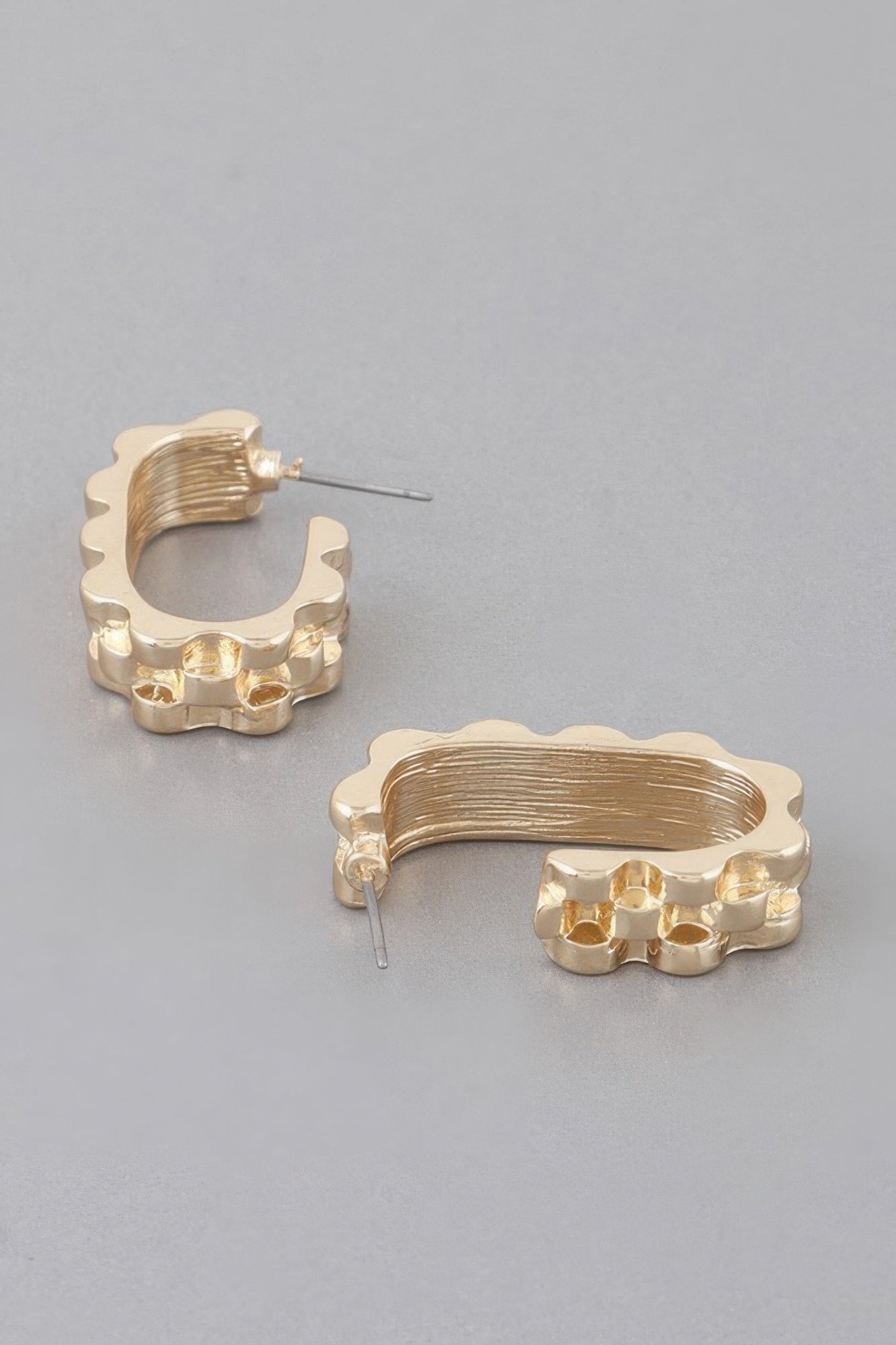 Textured cuff earrings, gold-tone, sculpted band with textured rim and stud post