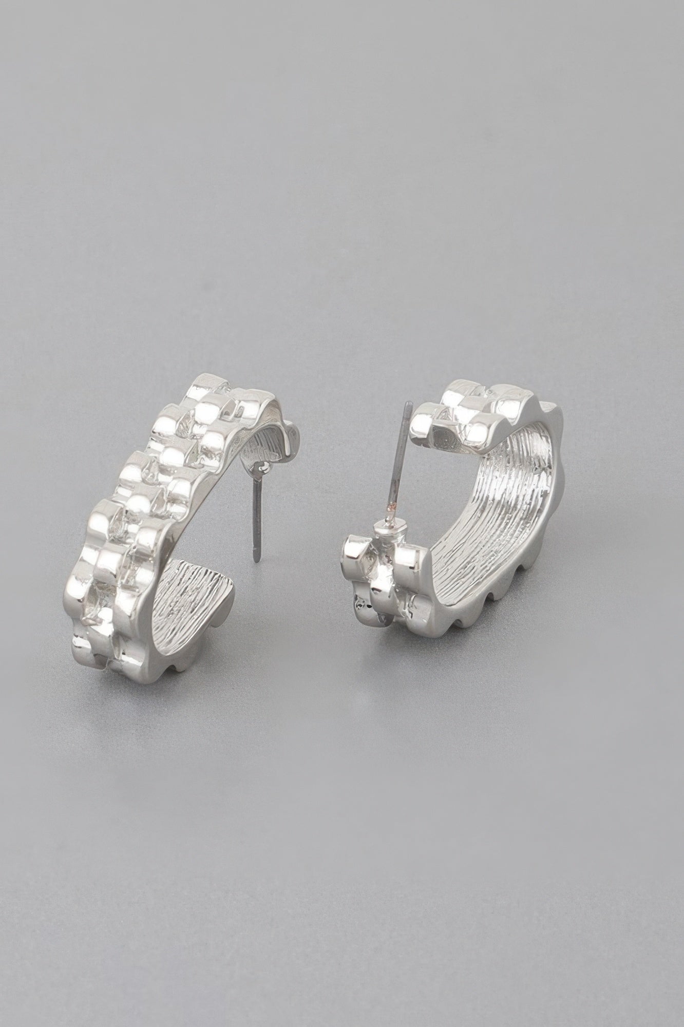 Textured cuff earrings, silver-tone, checker-texture hoop with stud posts and scalloped edge