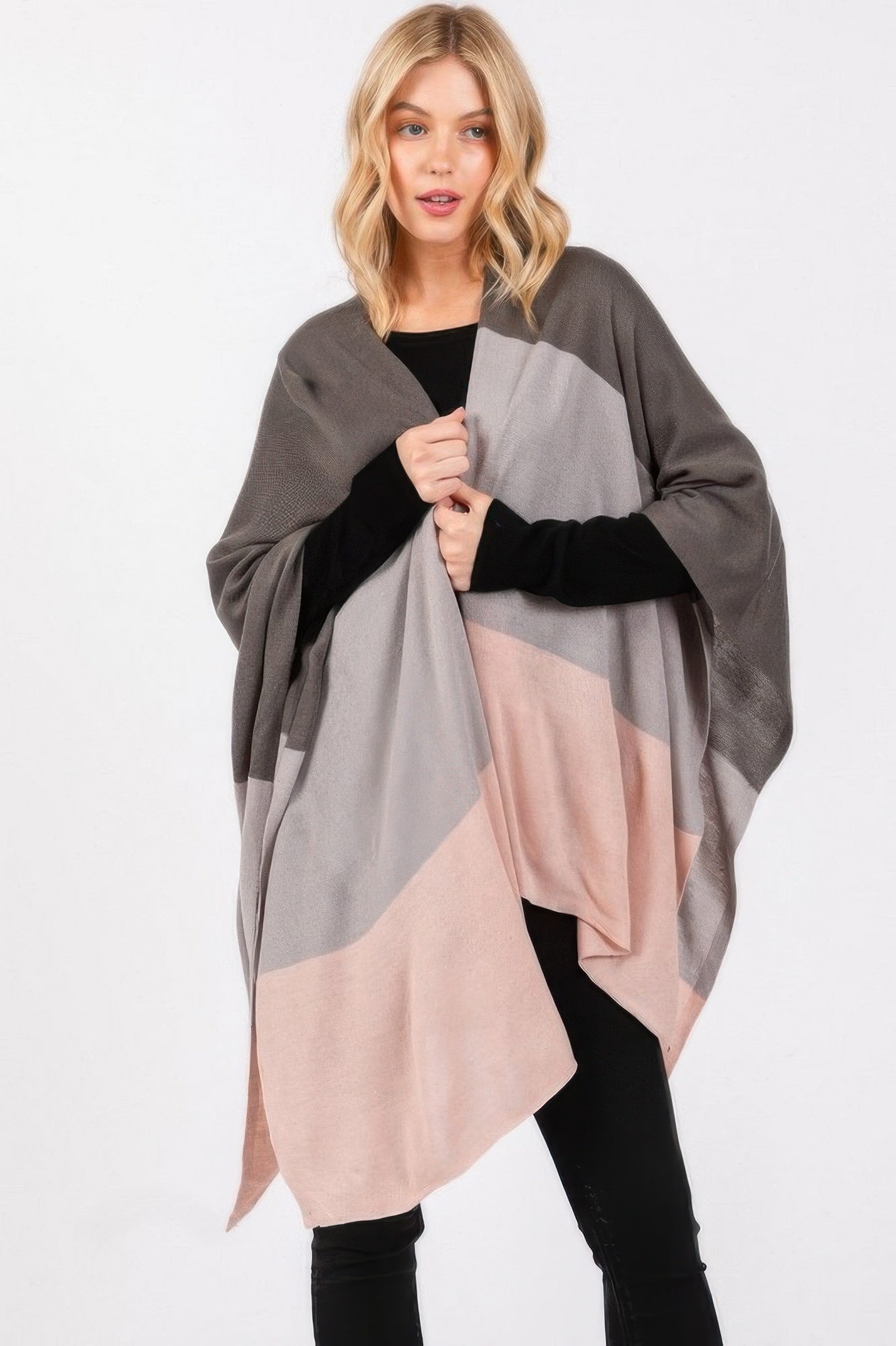 Three-tone ruana in charcoal, light gray, and blush pink blocks; open poncho fit.
