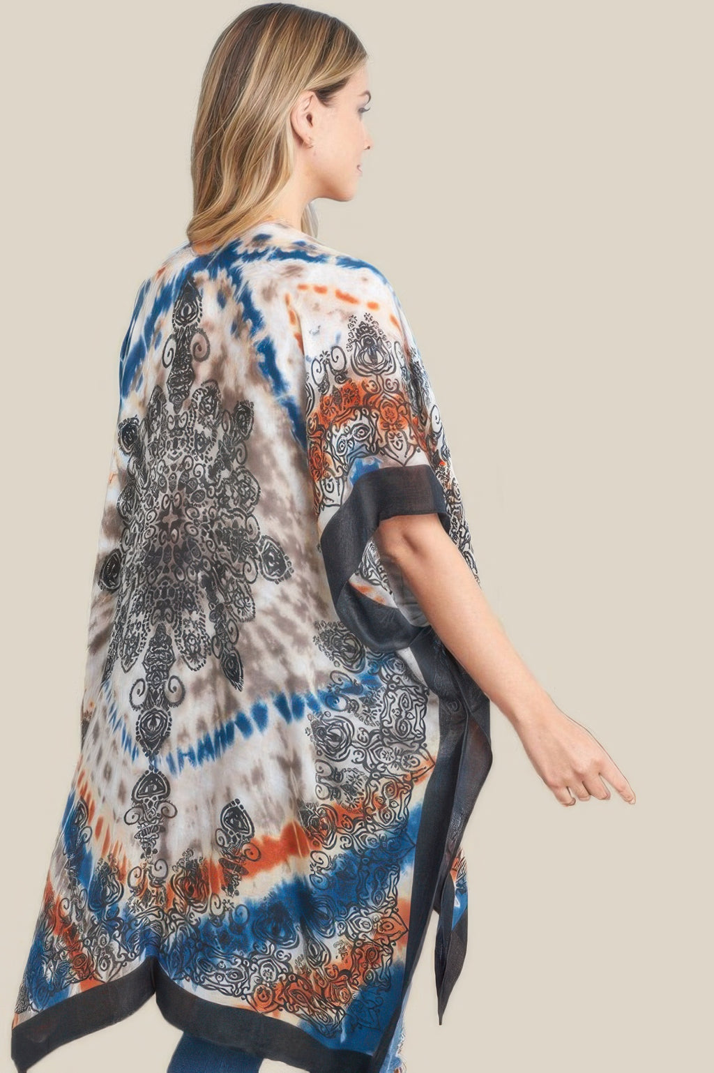Back view tie dye boho kimono with blue and orange swirls, black accents