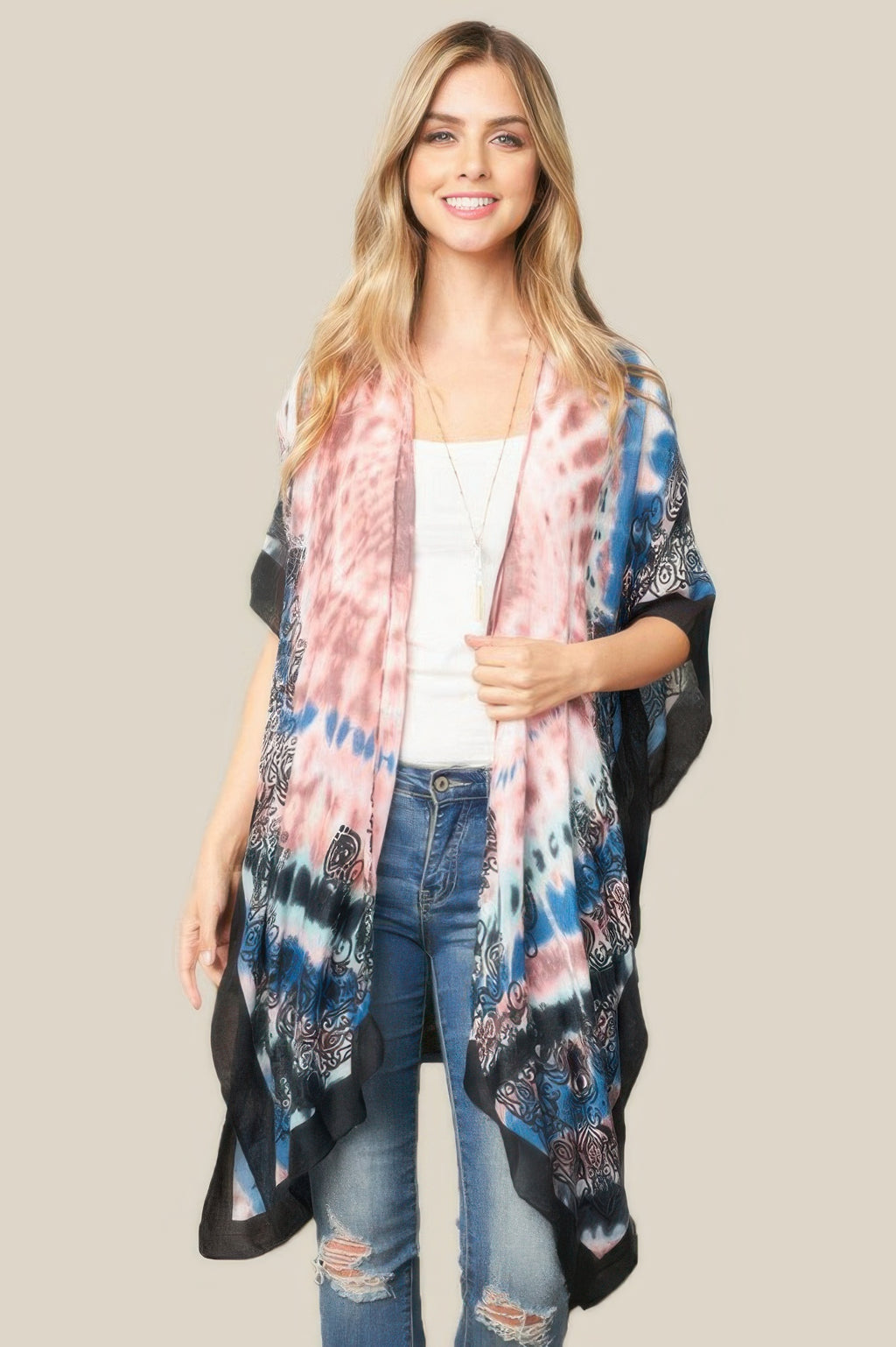 Tie dye boho kimono in pink and blue with black trim and paisley-style prints