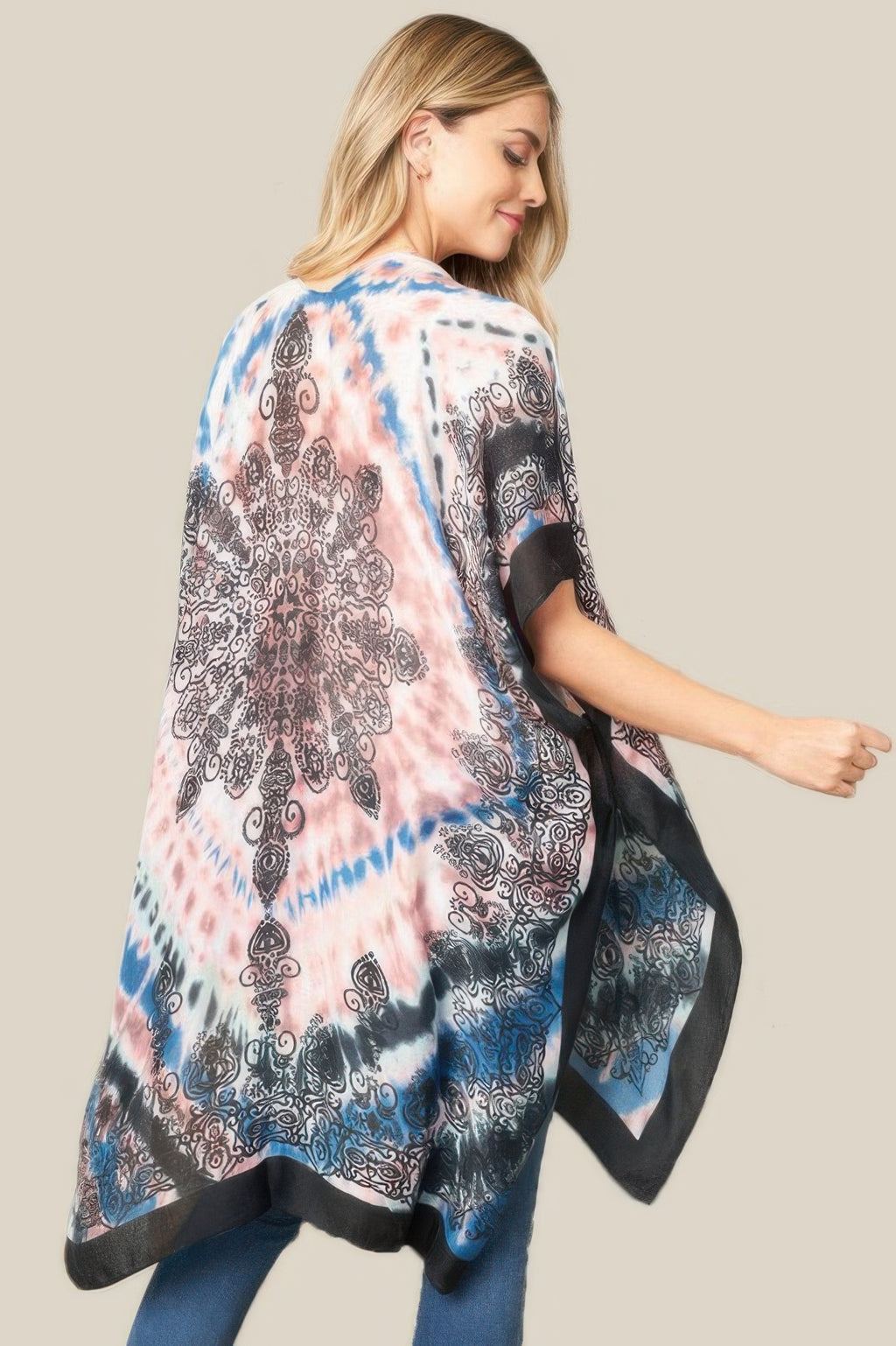 Back tie dye boho kimono with pink, blue, and black swirling prints and loose drape
