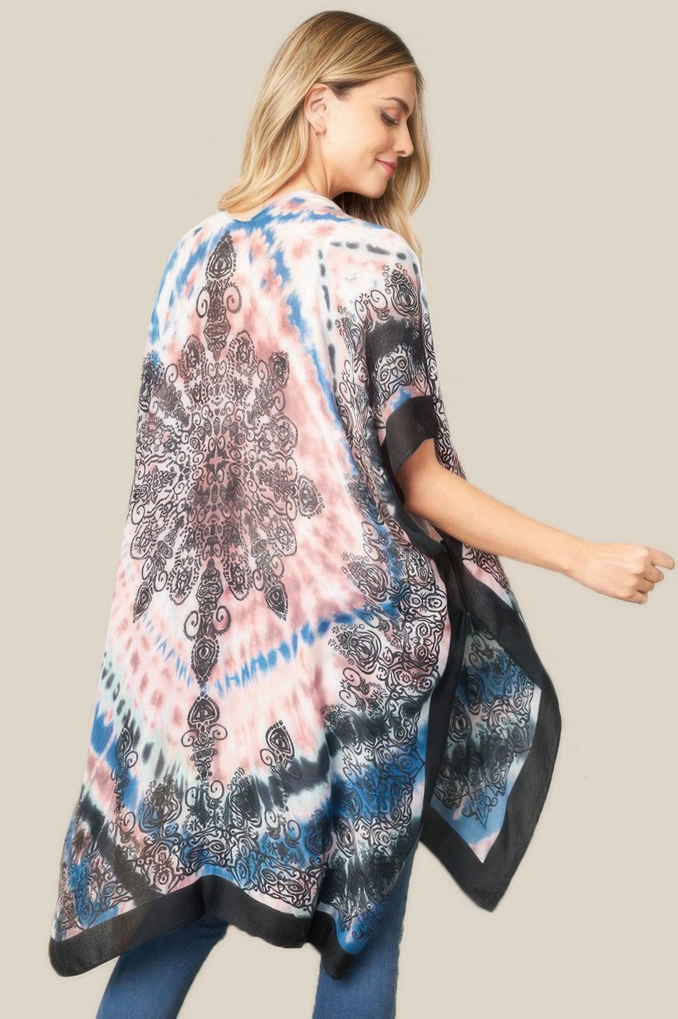 Back tie dye boho kimono with pink, blue, and black swirling prints and loose drape