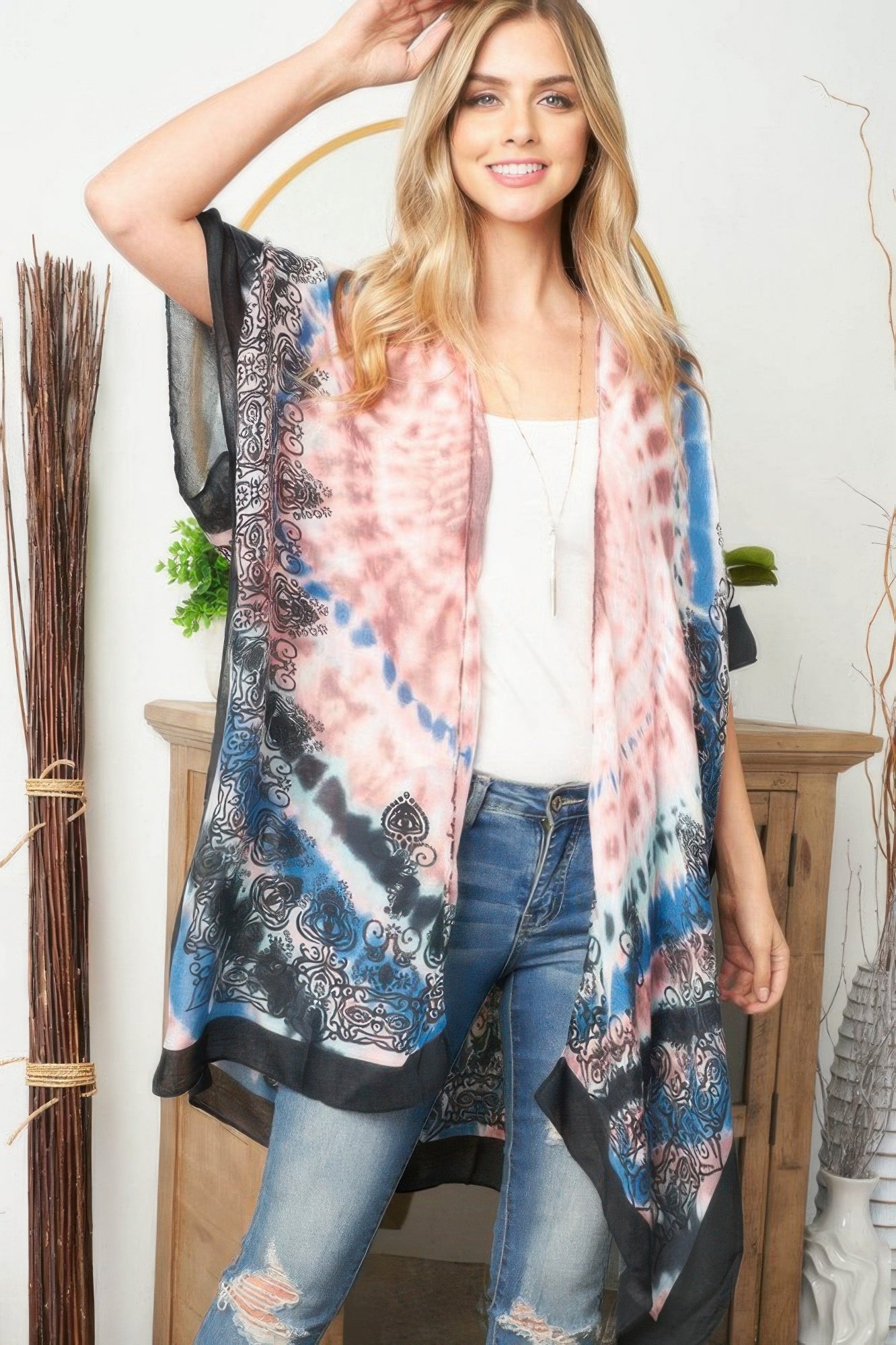 Tie dye boho kimono with pink center panel, blue corners, and black trim