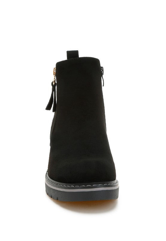 Black ankle boot with side zipper, rounded toe, and rubber sole edge
