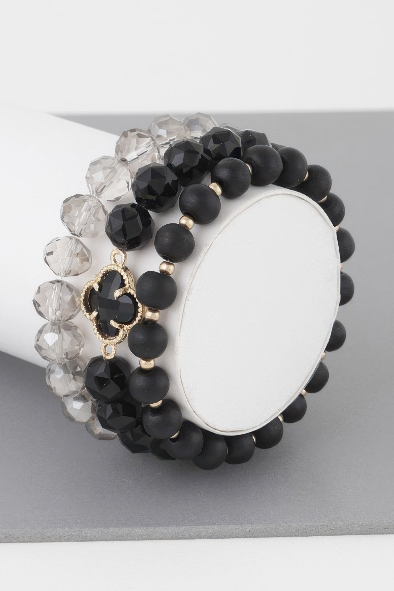 Triple crystal clover bead bracelet with black beads, clear crystals, gold clover charm
