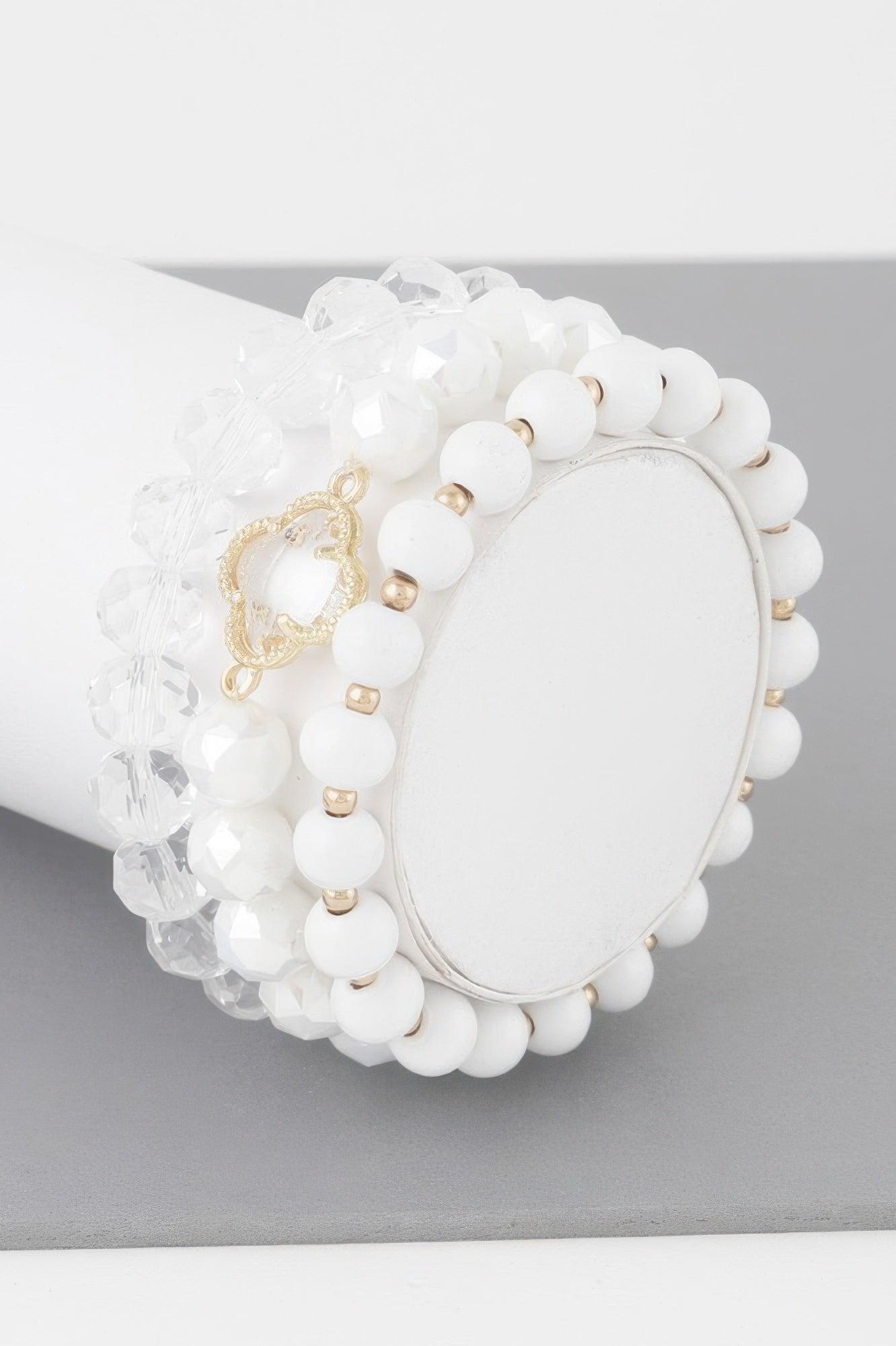 White beaded clover crystal bracelet with gold-toned charm and round bead cluster