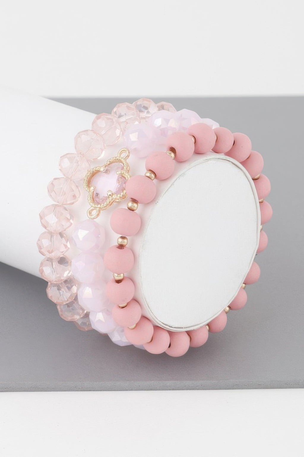 Pink beaded clover crystal bracelet with gold-toned clover charm and crystal bead strand